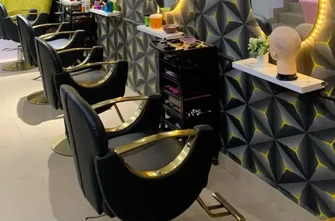 Styling chairs and lit mirrors in a neighbourhood salon